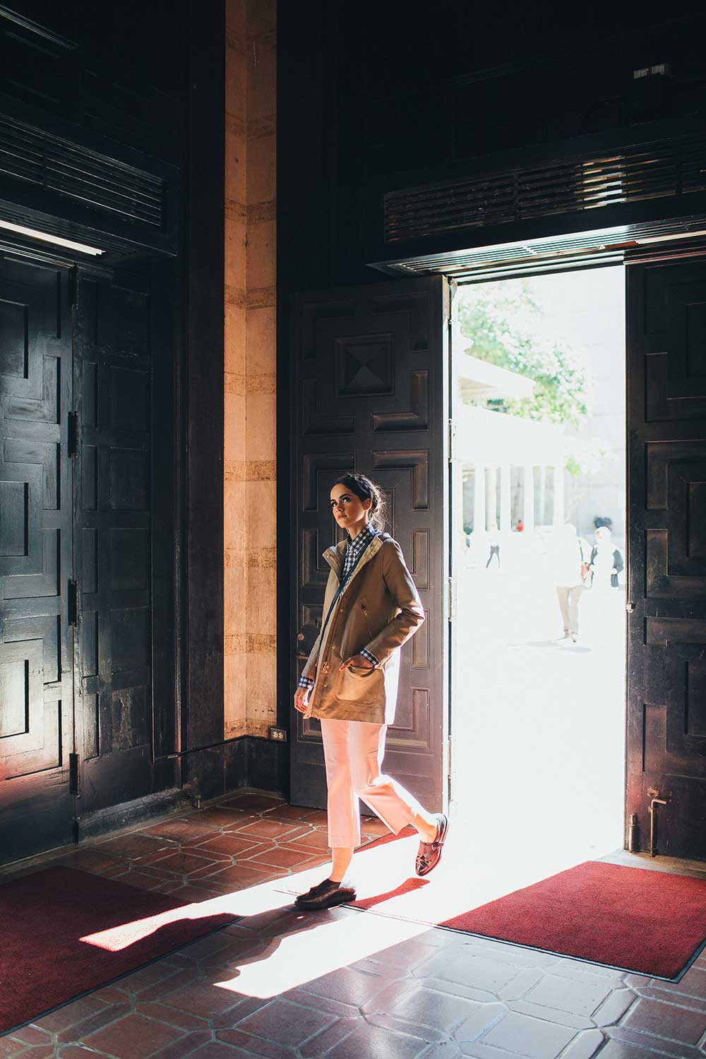 woman walking through entrance of Old Honolulu Police Station