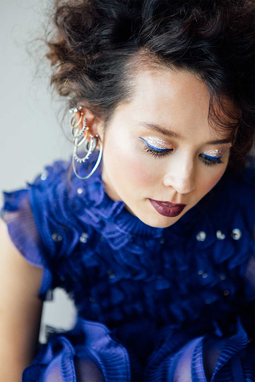Woman in a blue Alexandere McQueen dress